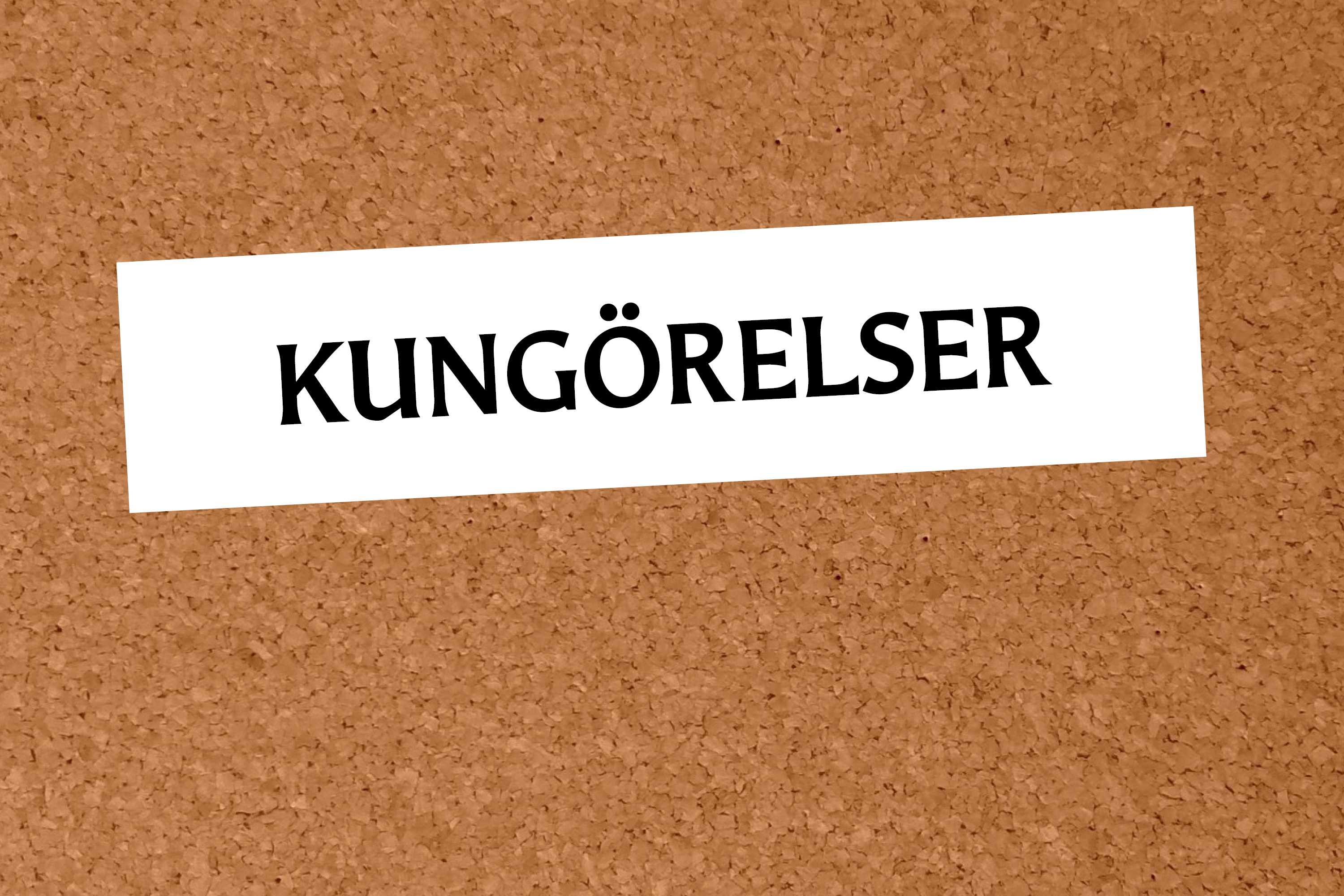 Anslagstavla av kork med en vit  lapp som det står 